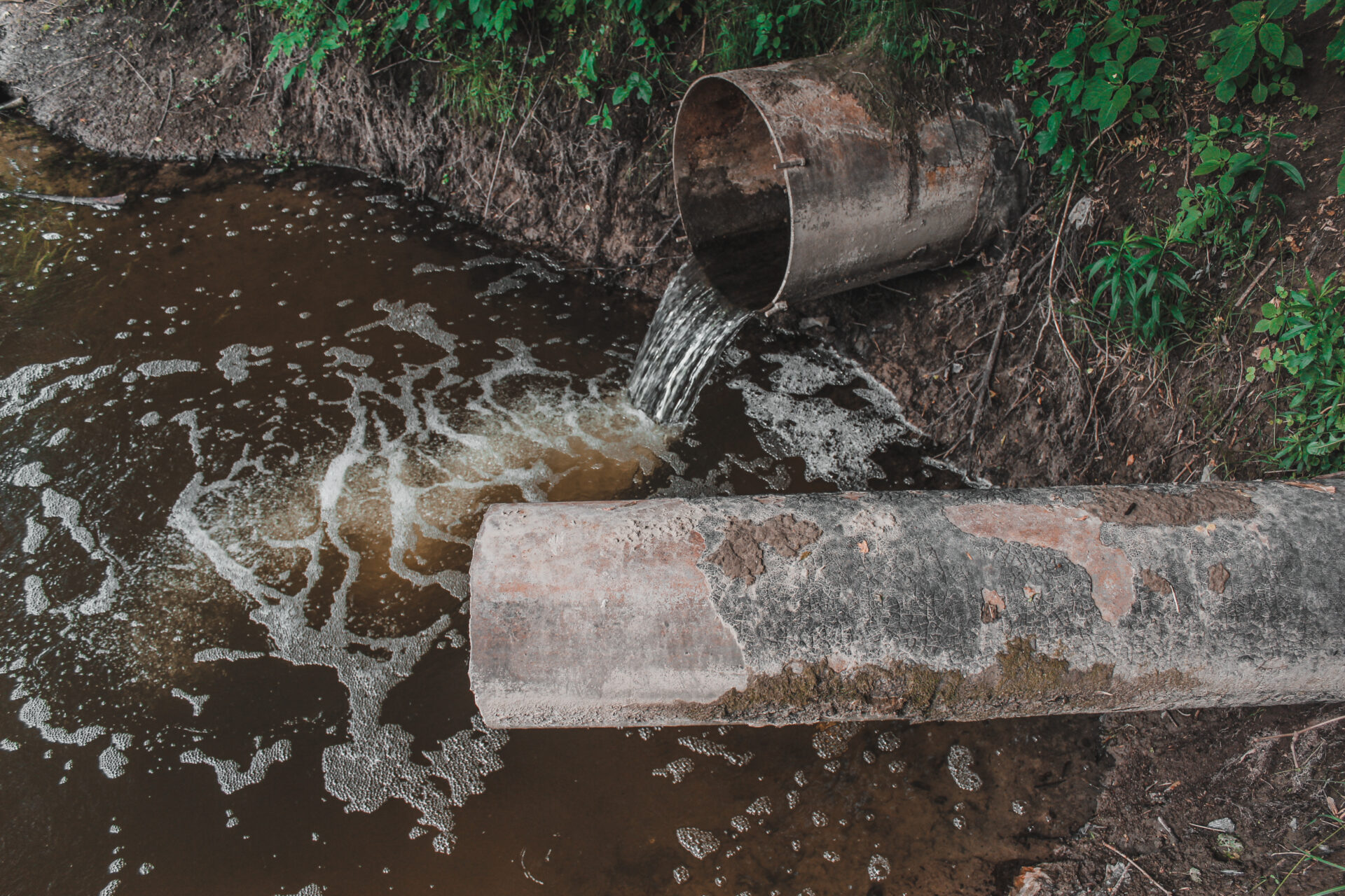 sewage flows into river pollution river